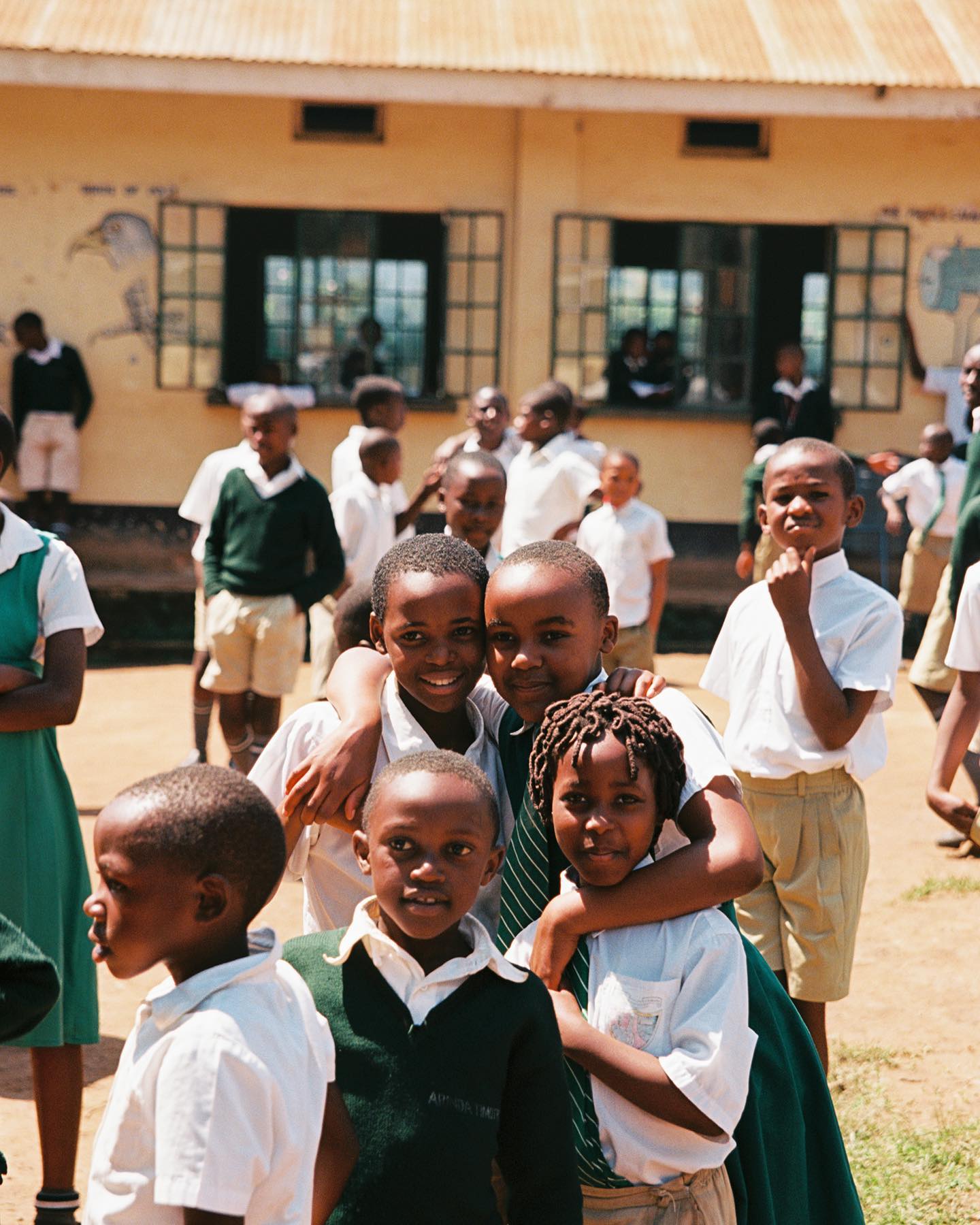 “Recess” • Kodak Ektar 100 35mm • Canon Rebel K2 • Sigma 24-70mm f2.8 ••••#kids #school #recess #uganda #africa #latergram #film #filmphotography #photography #dutchangle #horizon #tilt #snapshot #filmsnotdead #kodak #ektar100